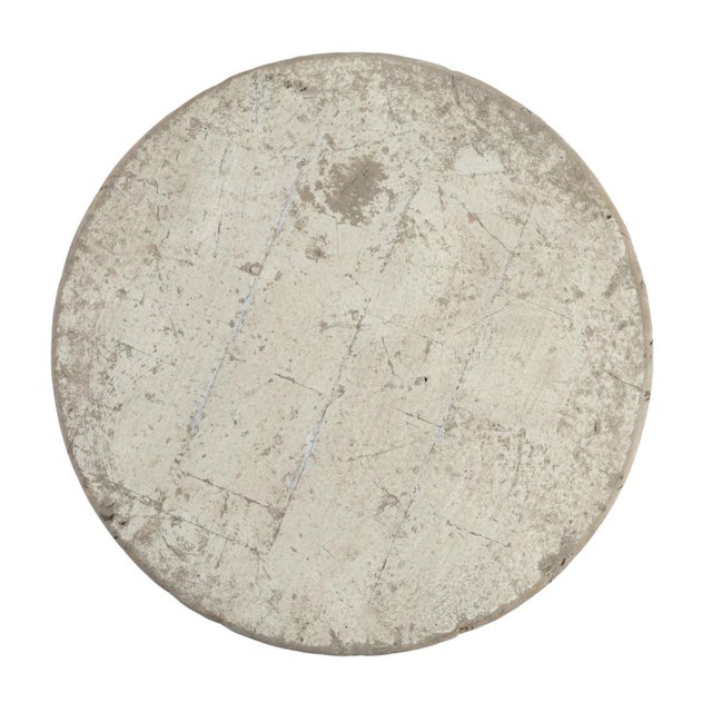 Modern round reclaimed pine wood side table on hand hammered iron base. Antiqued distressed white finish on wood. Each...