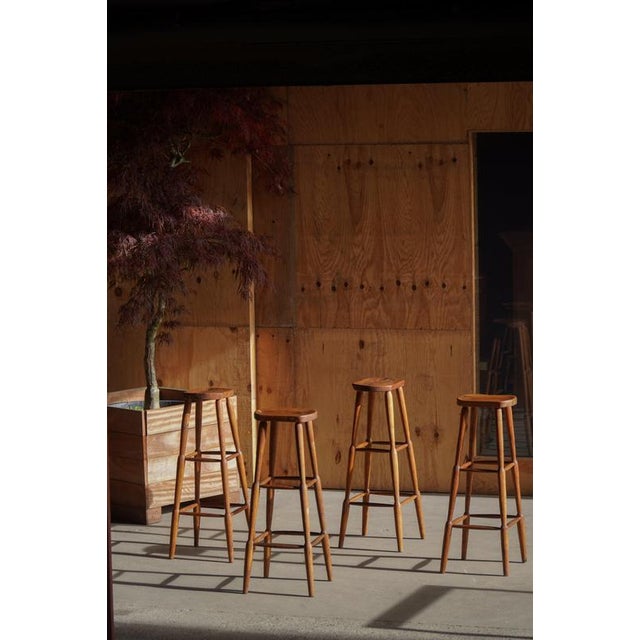 A beautiful and characterful set of four rustic pine bar stools, made in Sweden in the early 20th century. Each stool...