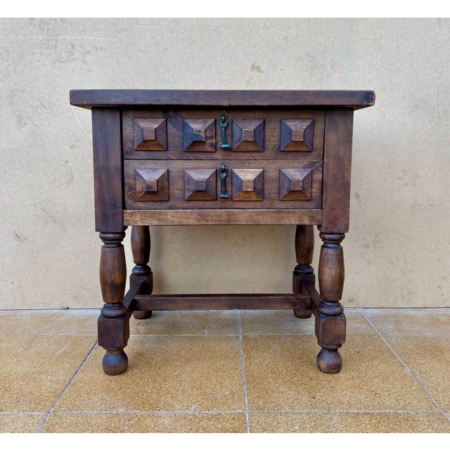 This solid walnut side table is a fine example of Spanish furniture inspired by Baroque traditions, crafted during the...
