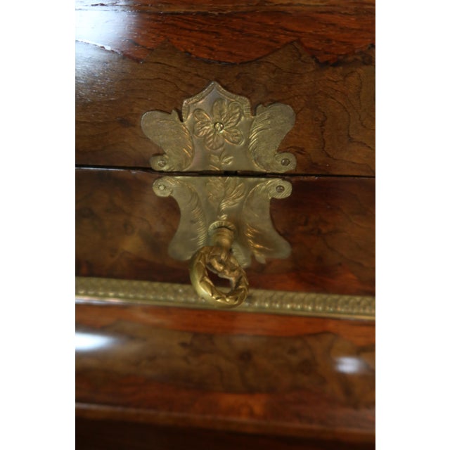 Marquetry jewelry box on its table from the Napoleon III period. This Louis XV style table rests on four curved legs...