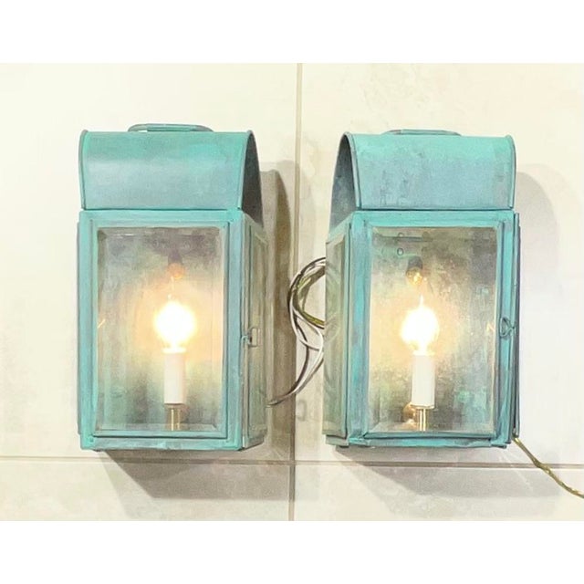 Elegant pair of Antique Copper Wall Lantern Originally crafted as oil lamps, these pieces have been professionally...