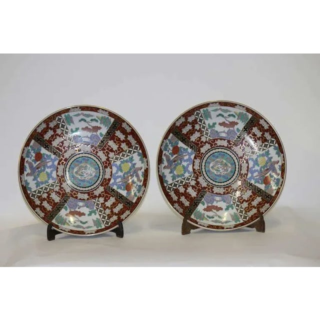 Pair Large 18”dia. Japanese Imari 19th century chargers. Fine porcelain with multi floral reserves of various forms. Very...