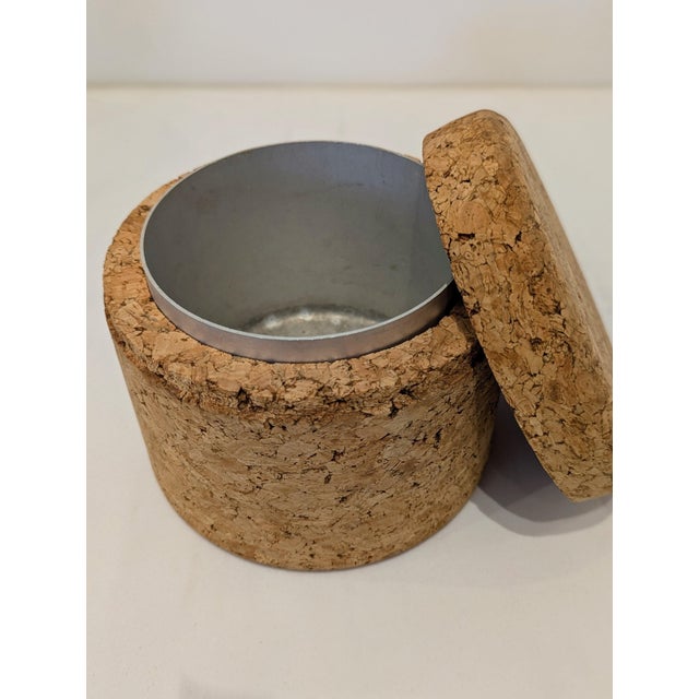 Minimalist vintage ice bucket constructed entirely from compressed natural cork. Cylindrical form with flush lid and...