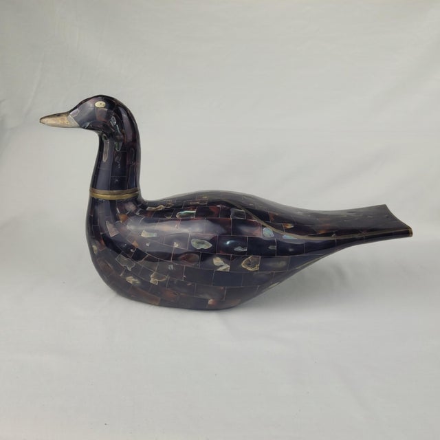 Maitland Smith tessellated faux tortoise shell and mother of pearl duck figurine. This handcrafted decorative piece...