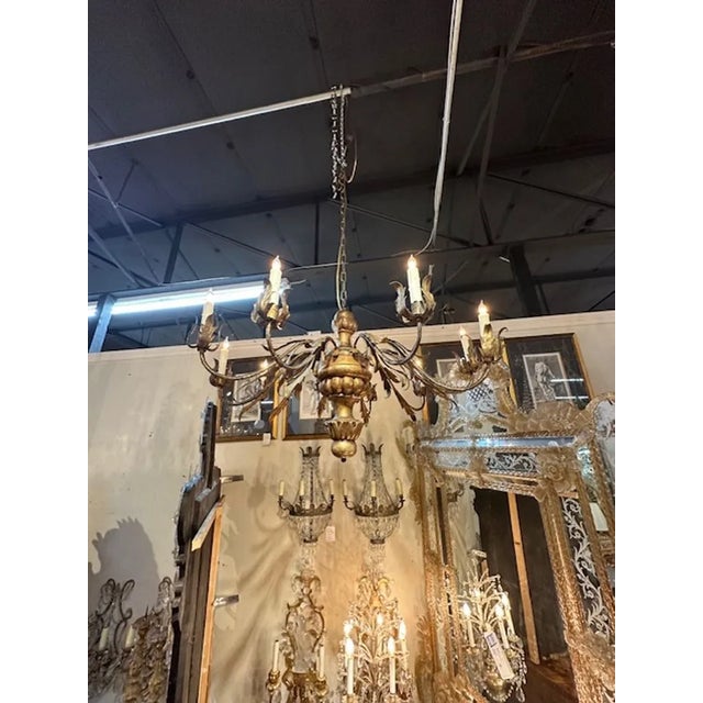 18th century Italian carved and giltwood 10-light chandelier. Circa 1780. The chandelier has been professionally rewired,...
