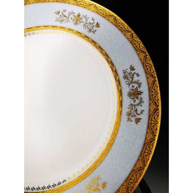 A rare and superb set of 12 Limoges porcelain dessert plates by Philippe Deshoulières in the "Orsay" pattern (sky gray)....