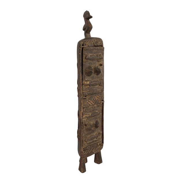 Superb and unique hand-carved wooden box from the Dogon tribe of Mali, featuring a double-door design traditionally used...