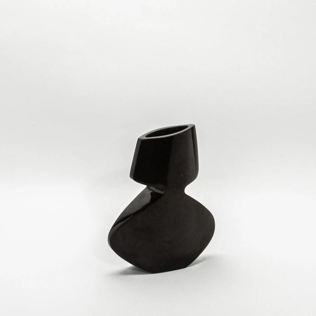 The "Vase La Feme" by R&Y Augousti is an exquisite embodiment of modern sculptural elegance, handcrafted from luxurious...