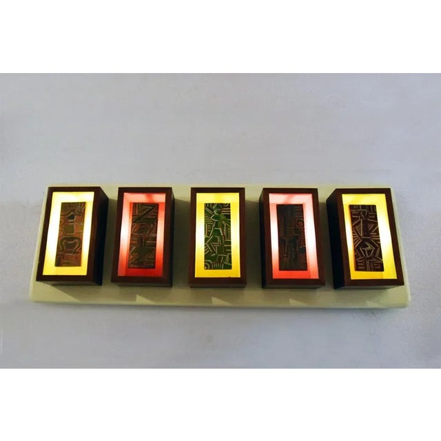 Futurist-style wall light panel, Italian production early 1950s. Five wooden modules with hand-painted decoration and...