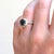 This double halo ring (circa 2000) is masterfully crafted in solid 18k gold. At the heart of this masterpiece sits a...