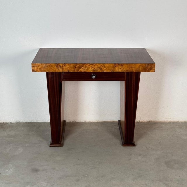 Elegant Italian Art Deco console or small writing desk from the 1930s, finely crafted and fully finished on both sides,...