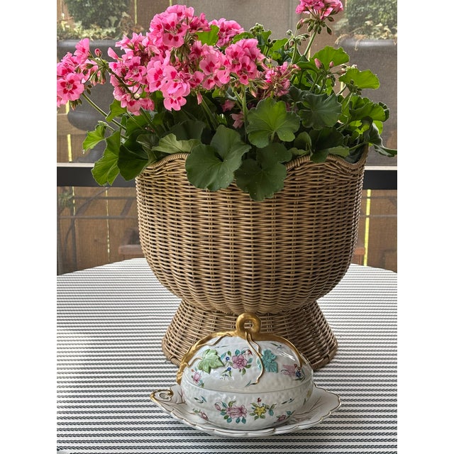 This elegant serving piece features a hand-painted floral design in soft pastel tones, accented by a sculptural gilt vine...