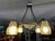 Elegant Art Deco chandelier dating from the 1930s, crafted from silvered bronze and molded opaline glass. This superb...