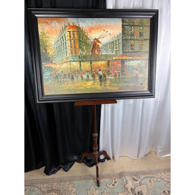 A dramatic and atmospheric mid‑century original oil painting capturing the iconic Moulin Rouge at dusk — that magical hour...