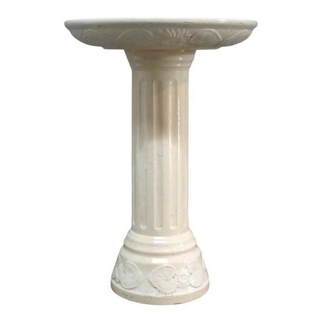 An exquisite Aesthetic Movement sculpture stand, dating to approximately 1880. This piece features a circular dark green...