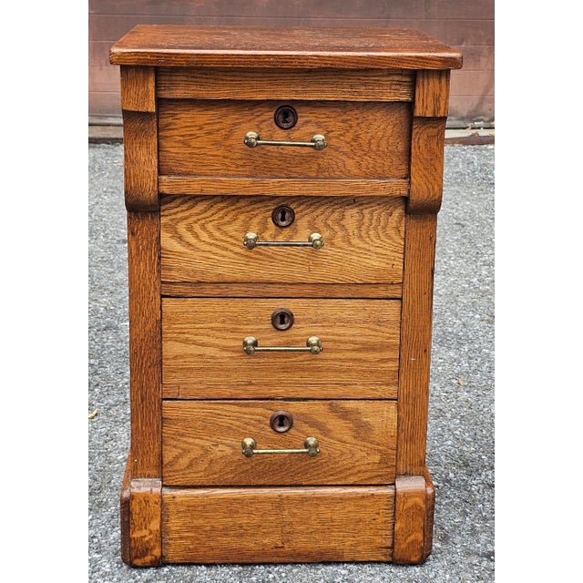 A Late 19th Century Victorian Oak Side Chest, Bedside table. Measures 17.5" in width x 16.5" in depth x 29" in height....