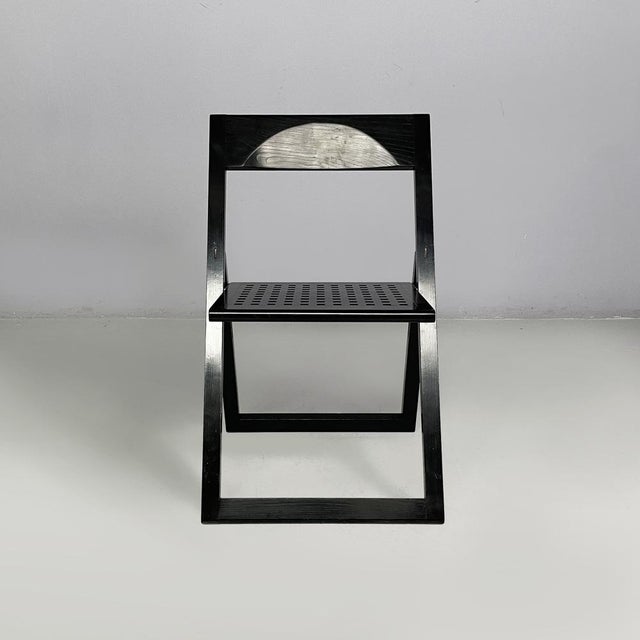 Italian modern black wooden folding chairs, 1980s Pair of folding chairs made entirely of black painted wood. The square...