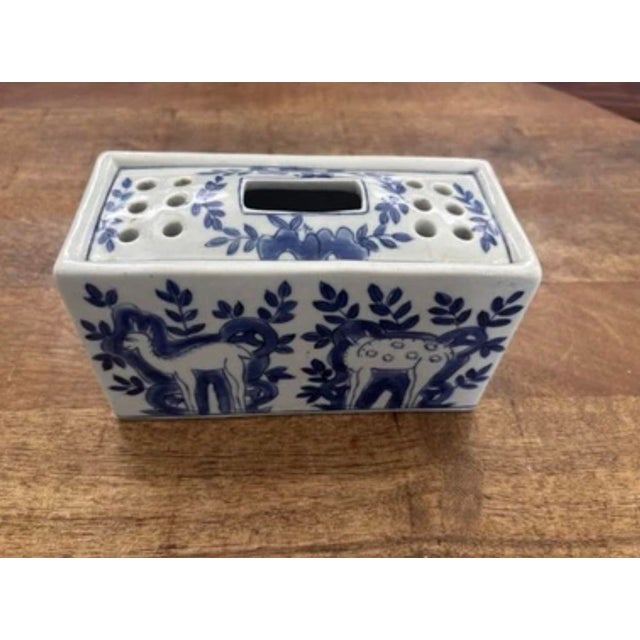 Absolutely lovely deflt-style blue and white flower frog with floral and animal Motif. Classic blue and white colors with...