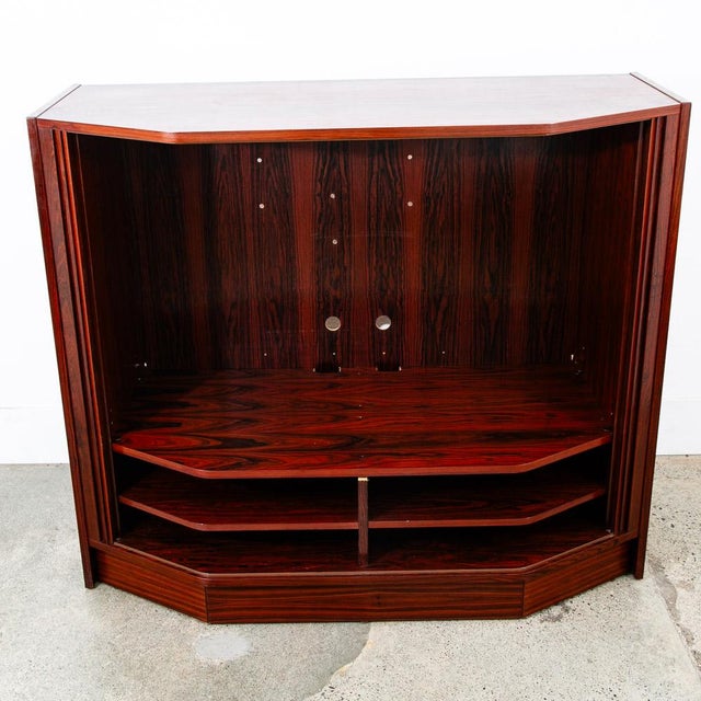 Poul Hundevad rosewood media cabinet with tambour doors. Large open area for a television or audio gear. Plenty of room...