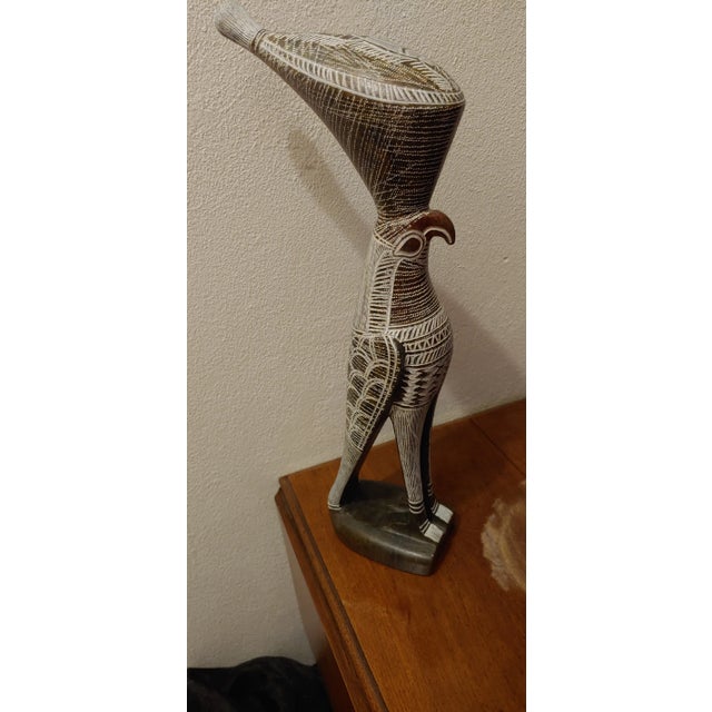 This beautiful deep green stone sculpture depicting a majestic hawk, is handmade in Zimbabwe by Sculptor Luke Jimu. Jimu...