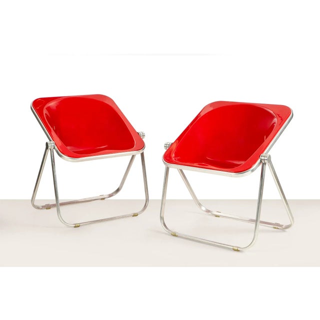 Pair of Plona armchairs, design Giancarlo Piretti for Anonima Castelli, 1970. Folding armchairs with chromed aluminum...