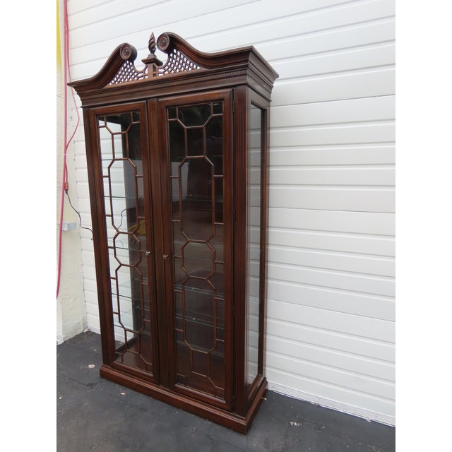 This beautiful China Cabinet is made of wood, solid wood, and glass. It was made by a fine furniture company Harden and it...