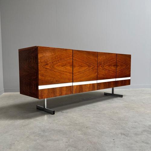 Remarks: Mid century sideboard by Pano, Germany 1960s. Wood veneer with four doors and four drawers. Chrome legs....