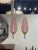 Stylish pair of pink Murano glass and brass leaf form wall sconces. Adds a beautiful decorative touch!