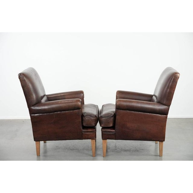 We are offering this beautiful set of two characterful sheepskin armchairs with a beautiful deep color. This comfortable...