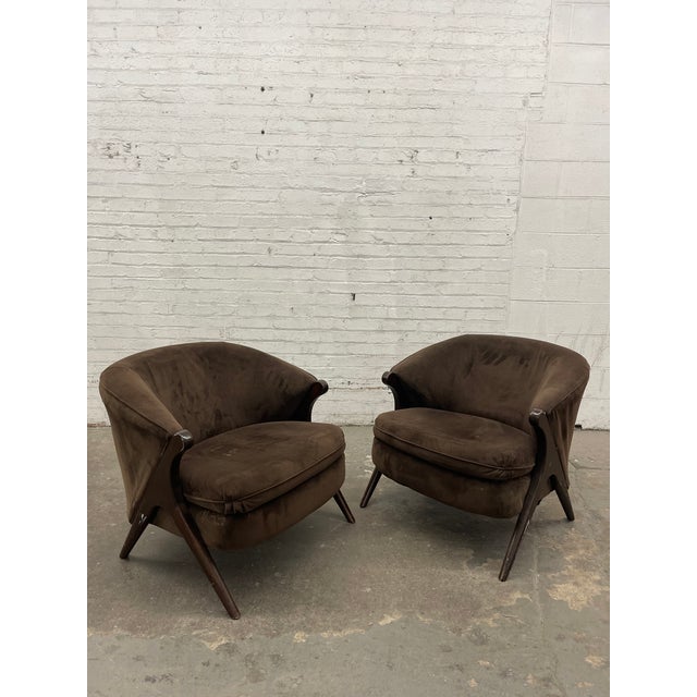 This stunning and unbelievably comfortable pair of barrel back lounge chairs in the style of Karpen of California would...