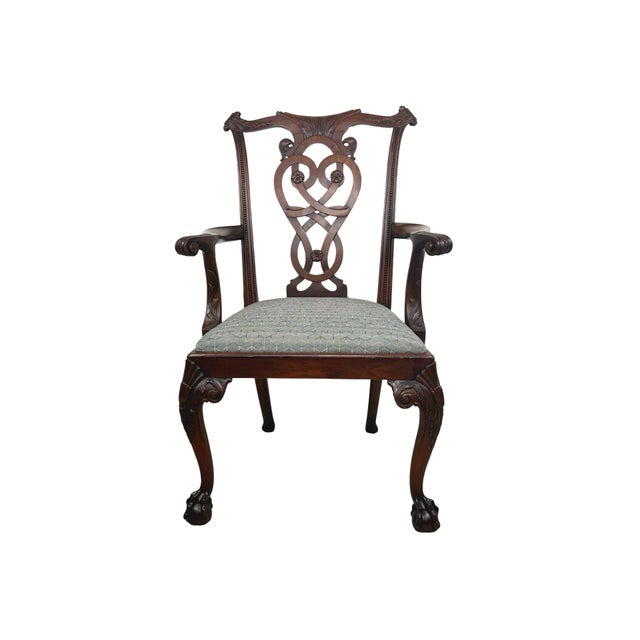 A richly detailed vintage Chippendale Revival armchair by Maitland-Smith, hand made in the Philippines and retaining its...