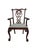 A richly detailed vintage Chippendale Revival armchair by Maitland-Smith, hand made in the Philippines and retaining its...