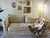 The upholstery is a custom designer velvet in a sophisticated Gold-Nude palette. It features a dense, heavy-weight pile...