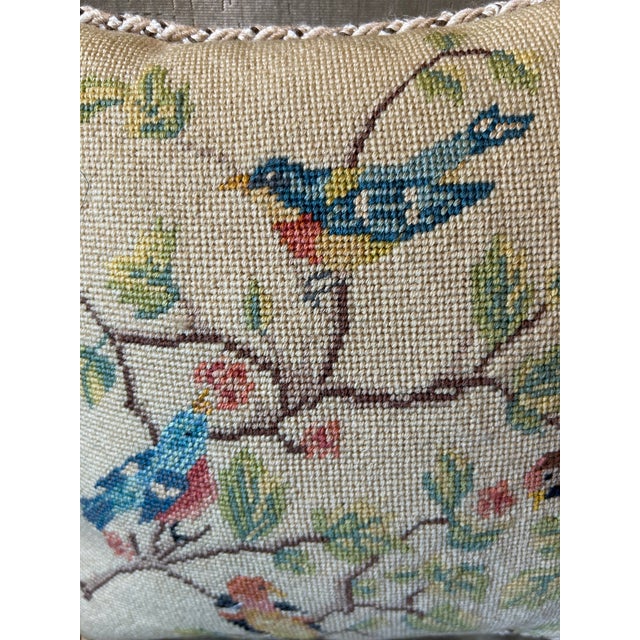 A pillow made from a hand stitched needlepoint panel with a charming flora and fauna motif. 2 available