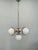 Art deco chandelier produced in 1930s czechoslovakia. This refined lighting fixture features a nickel-plated metal...