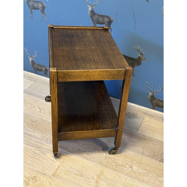 Oak trolley in good condition. Suitable for multiple purposes. For books, drinks table, printer table, etc. Origin:...