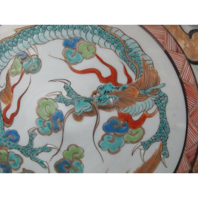 Japanese Meiji era Imari charger plate or shallow bowl. Intricate, brightly hand painted panels showing flowers, birds,...