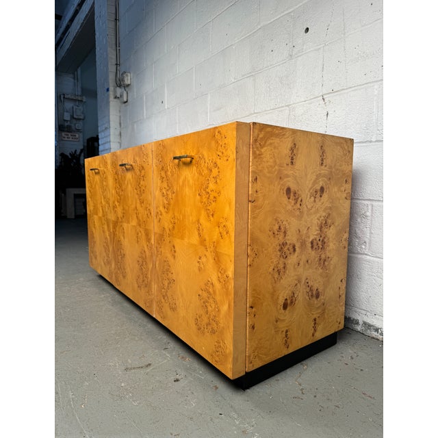 Vintage mid-century modern burl wood sideboard in the style of Milo Baughman and Arthur Umanoff, featuring rich,...