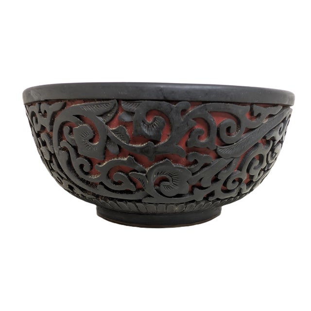 A beautiful Chinese Carved Cinnabar Lacquered Bowl, around late 19th century. The bowl features intricate, deep relief...