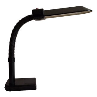Vintage Adjustable Italian Desk Lamp from the 80s with Black Plastic Housing by Sylvania, 1980s For Sale