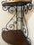This is a mid 20th century wrought iron Bakers rack. This is a lovely, heavy corner baker's rack made of iron and wood...