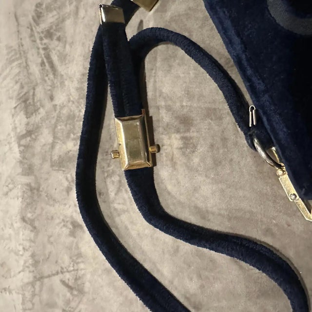 Step back into the 1980s with this striking Italian shoulder bag, crafted from rich midnight blue velvet that exudes...
