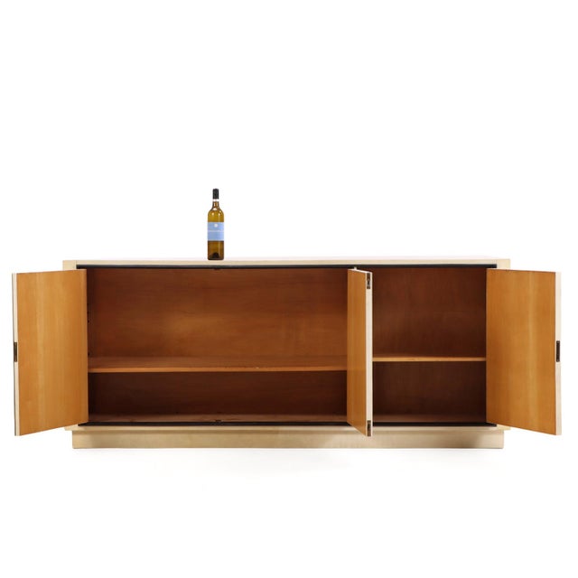 This sideboard is one of a pair that we have received in. The refined ebonized trim framing the parchment adds a touch of...