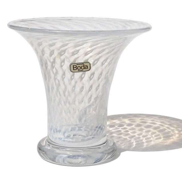 Beautiful vintage Bertil Vallien hand blown opaline white with bubble design Swedish art glass footed flower vase. The...