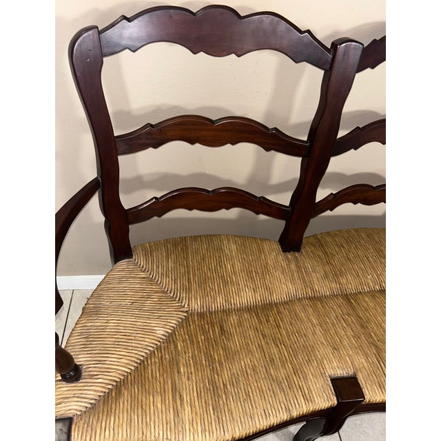 This vintage Indonesian double-seat bench features classic French Country styling with ladder-back construction,...