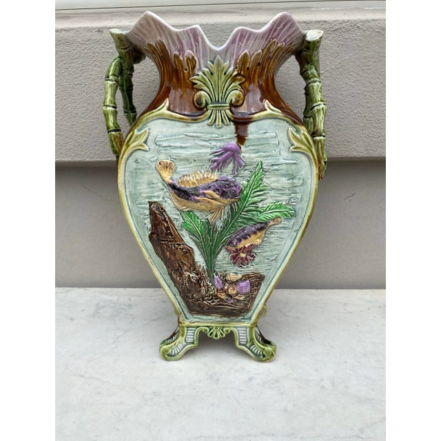 French Majolica vase with fishs and shells, circa 1880. Bamboo handles.