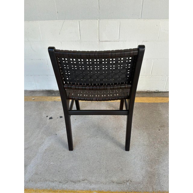 Stylish Made Goods Co Percy Leather Dining Chair. Dark brown weaved leather, black frame. Original Retail $1260. Showroom...