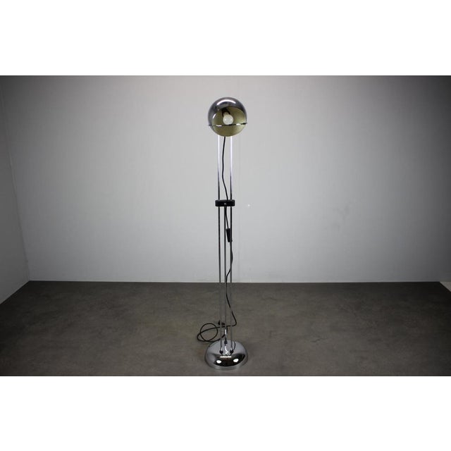This adjustable chrome floor lamp was produced in Italy during the 1960s and represents a classic example of Space Age and...