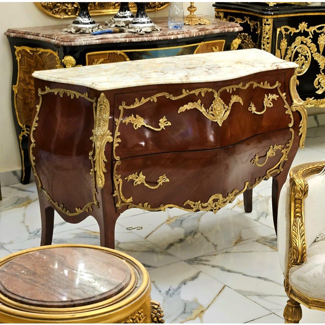 Experience the grandeur of European craftsmanship with this magnificent French Rococo-inspired dresser, masterfully...