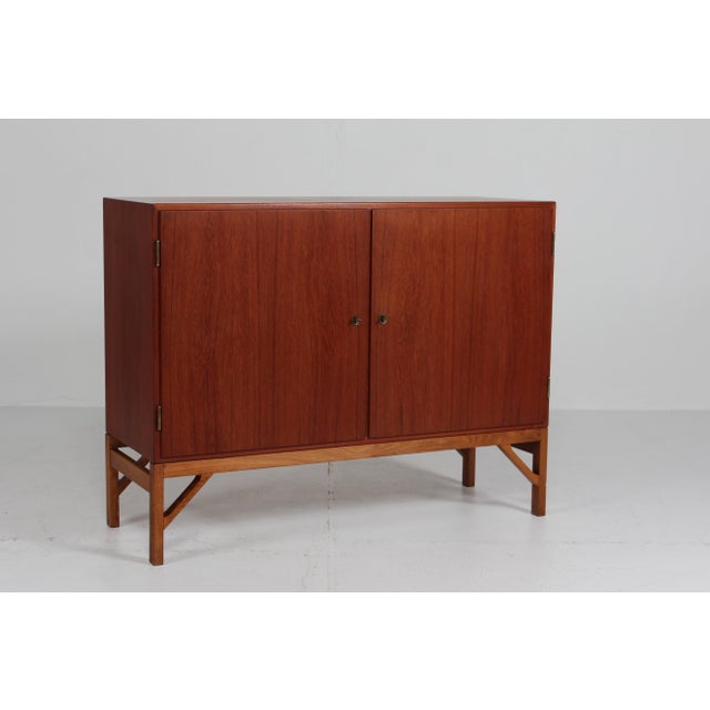 Danish architect Børge Mogensen (1914-1972) sideboard with china legs and 2 doors, inside drawers and adjustable shelves....
